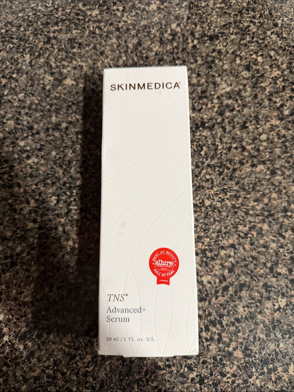 SkinMedica White Bottle with Red Seal Facial Serum